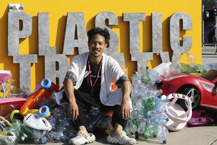 Artist drowns sculpture in plastic waste in front of the UN during plastic pollution treaty talks