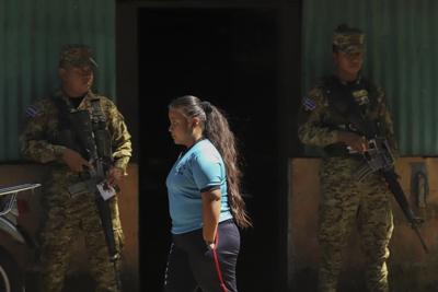 Thousands of soldiers fence off a Salvadoran neighborhood in pursuit of gang remnants