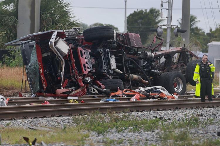 Train collides with fire truck in Florida. Police say 3 firefighters and at least 12 passengers hurt
