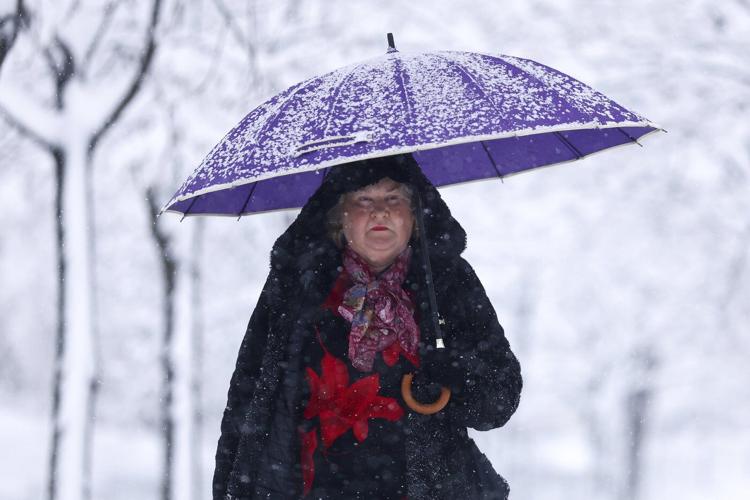 Balkans snowstorm leaves tens of thousands of homes without power and causes traffic chaos