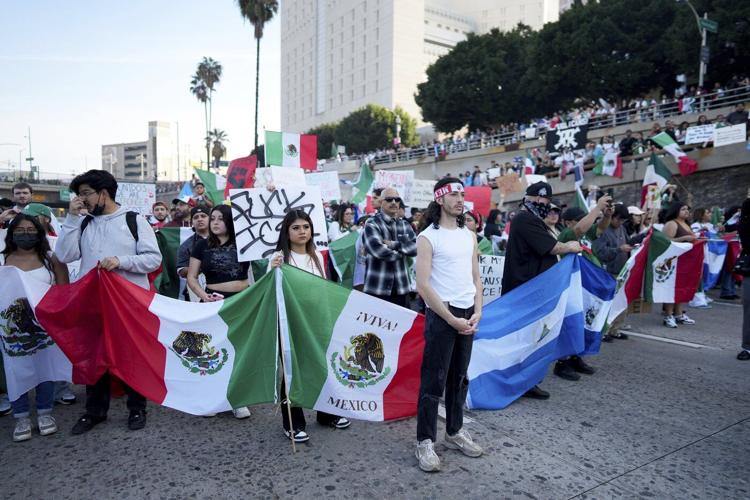 Marchers protesting planned deportations block major freeway in Los Angeles