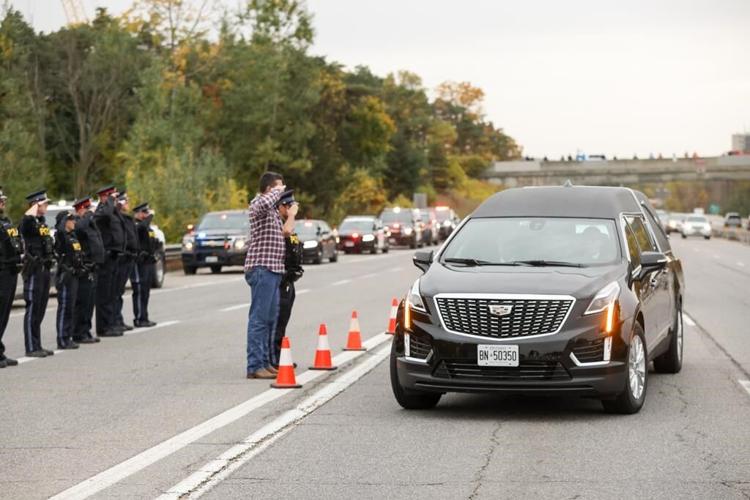 Hundreds of police officers take part in funeral procession for Innisfil, Ont., cops