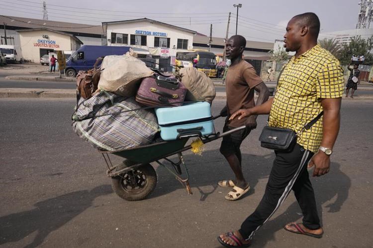 Nigeria slashes transport fees during the holidays to ease some of the pain of austerity measures