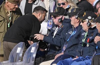 At D-Day ceremony, American veteran hugs Ukraine's Zelenskyy and calls him a savior