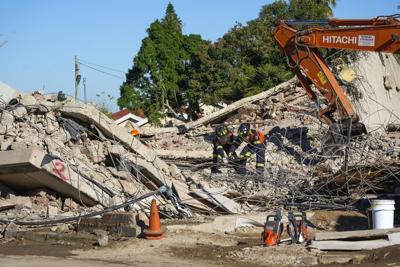 Death toll up to 32 in South Africa building collapse but rescue efforts boosted by 1 more survivor