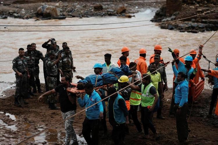 Rescuers search through mud and debris as deaths rise to 151 in landslides in southern India