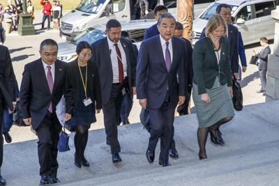 China's foreign minister meets New Zealand counterpart, beginning trip that also includes Australia