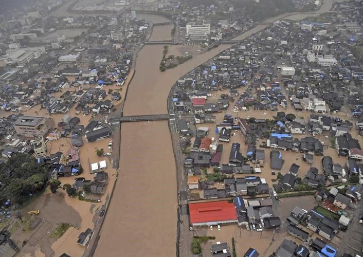 Rescue workers search for at least 6 people missing after heavy rain pounds Japan’s Noto region