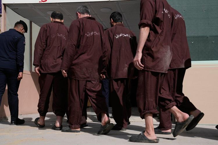 IS suspects transferred from Syria to Iraq are interrogated in a Baghdad prison