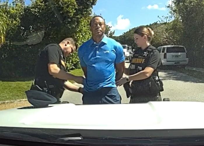 Bodycam shows a stunned Tiger Woods handcuffed after a Florida rollover crash