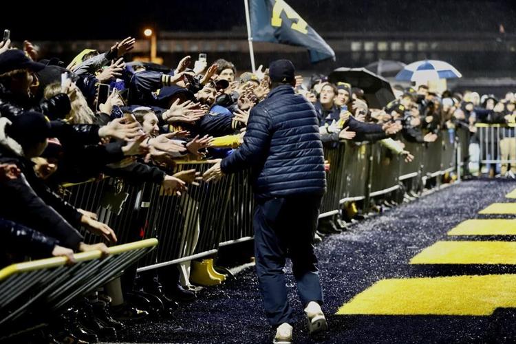Michigan Wolverines return home to screaming fans after victory over Washington Huskies