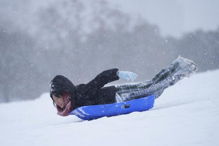 Winter storm that dropped record-breaking snow in New Orleans spreads into Florida and the Carolinas