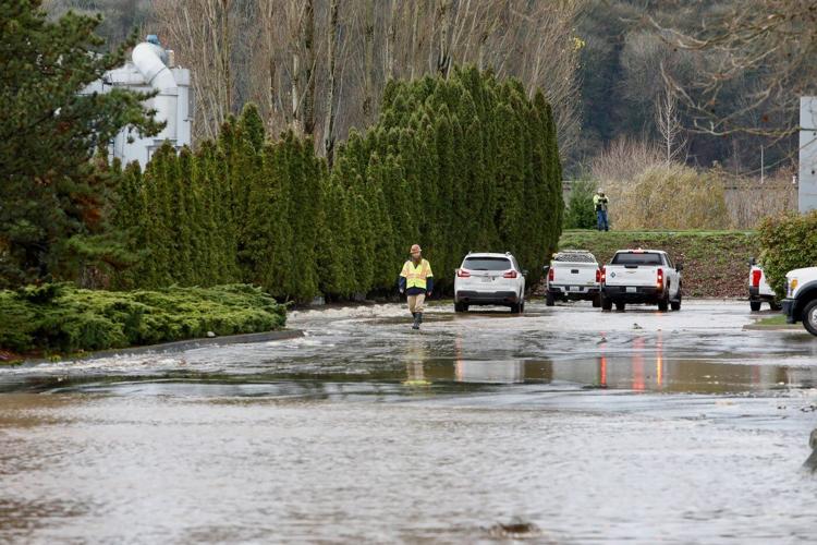 A driver is found dead in a submerged car near Seattle after a week of heavy rain and flooding