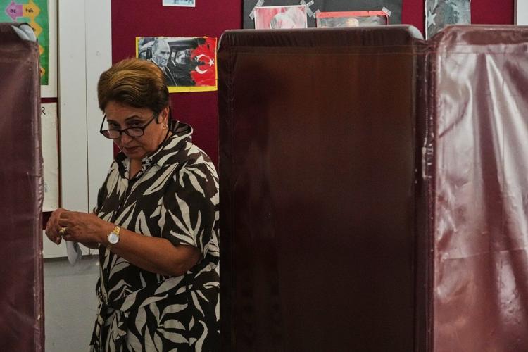 Turkish Cypriots vote in an election seen as a choice on deeper Turkey ties or closer EU relations
