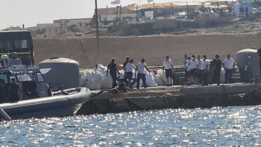 A boat carrying migrants capsizes off Italy, killing at least 26