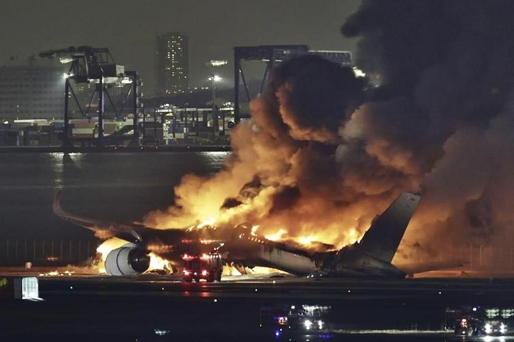 Planes catch fire after a collision at Japan's Haneda airport, killing 5. Hundreds evacuated safely