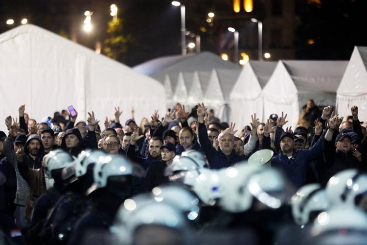 Riot police separate opponents, loyalists of Serbia's president as tensions soar amid protests