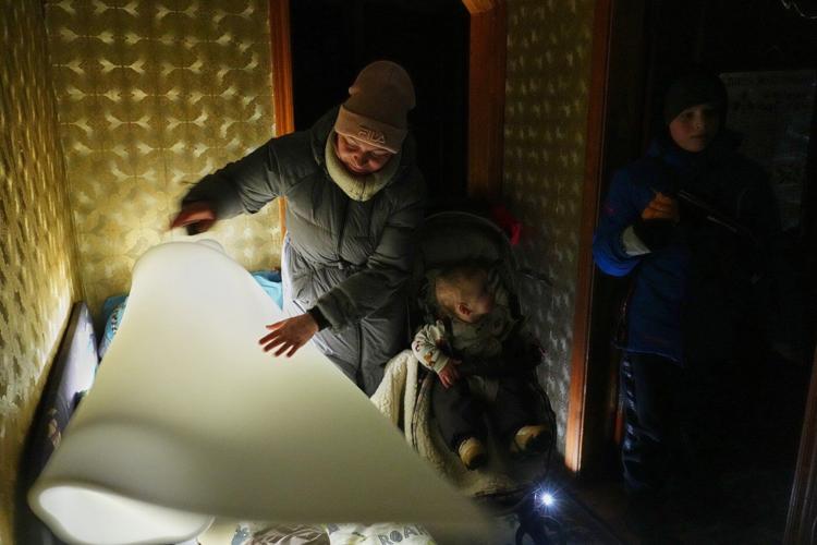 In the Ukrainian capital, a mother struggles to keep her children warm and fed amid power outages