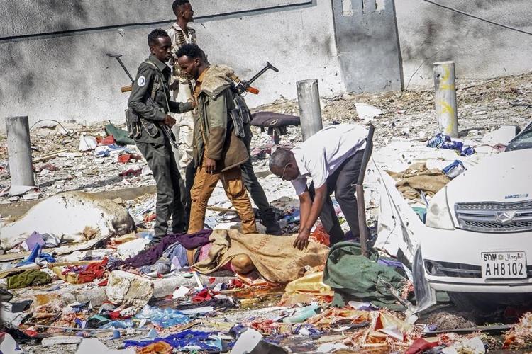 Somalia's president says at least 100 killed in car bombings