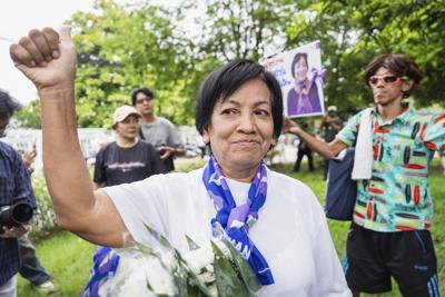 A royal pardon frees a Thai woman serving a 43-year prison term for defaming the monarchy