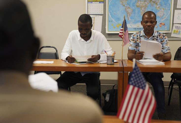 Migrants to Iowa strike different portraits where 'American Gothic' was created