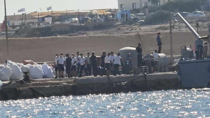 A boat carrying migrants capsizes off Italy, killing at least 26