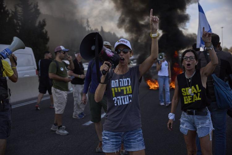 Photos of Israelis demanding the release of hostages and an end to the war with Hamas