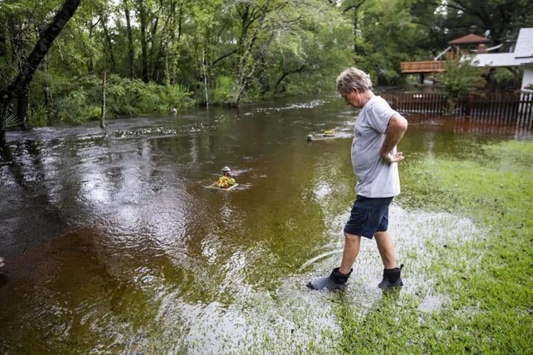 The Latest: A downgraded Debby still threatens with heavy rain and flooding