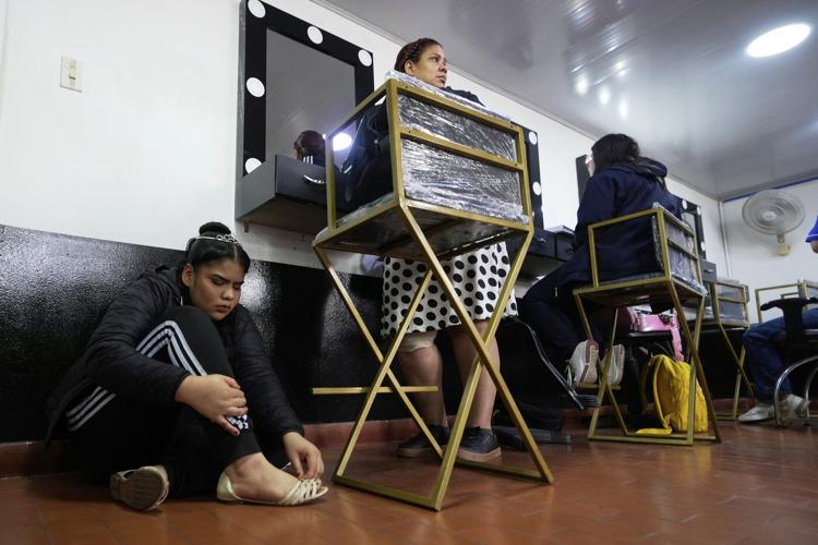 AP PHOTOS: Colombian quinceañeras see dream come true with the support of many, including the police