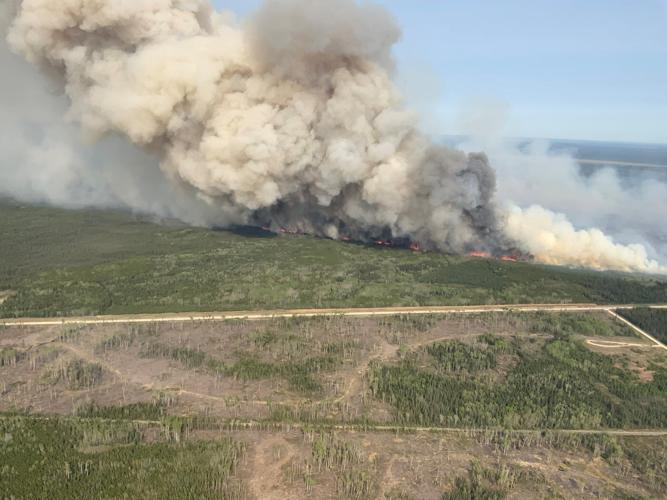 Thousands evacuated as wildfires continue burning in Manitoba, Saskatchewan, Alberta