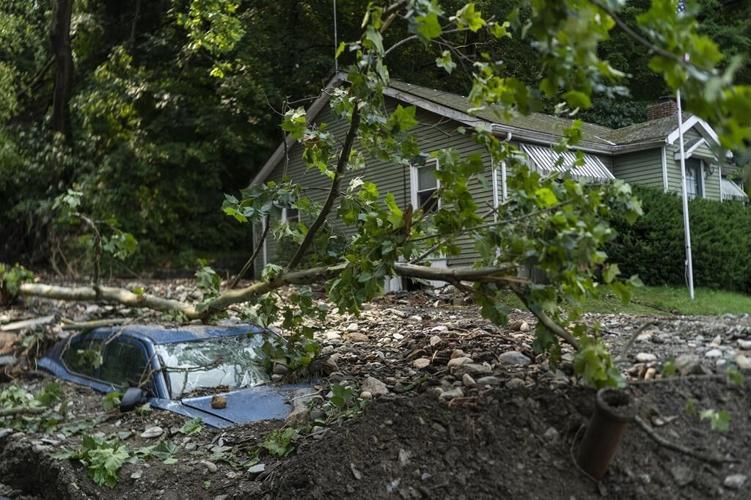 Children lost in flooding as US endures extreme weather, from smoke up north to heat in the West