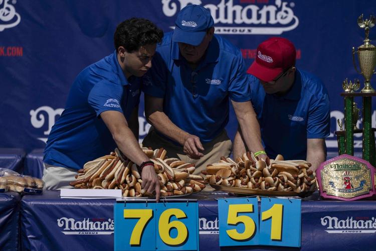 Joey Chestnut reclaims title in Nathan's Famous hot dog eating contest, wins 17th Mustard Belt