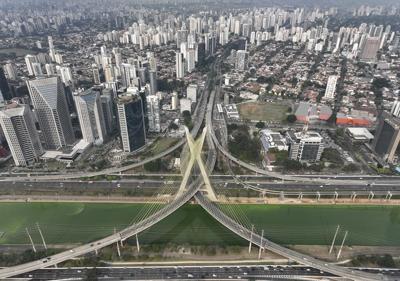 Drought is making Sao Paulo's river emerald green while smoke turns its skies grey
