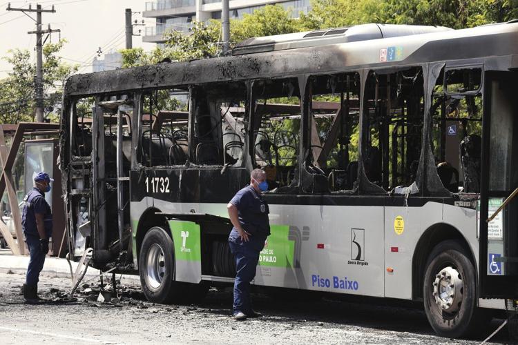 A small plane loses altitude after takeoff and slams into a Sao Paulo avenue, killing 2 passengers