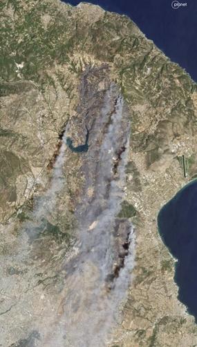 Crews battle scattered fires in Athens suburbs, helped by calmer winds and reinforcements