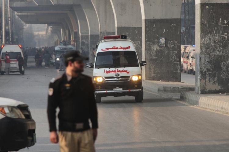 Suicide bombers strike security force headquarters in northwestern Pakistan, killing 3 officers