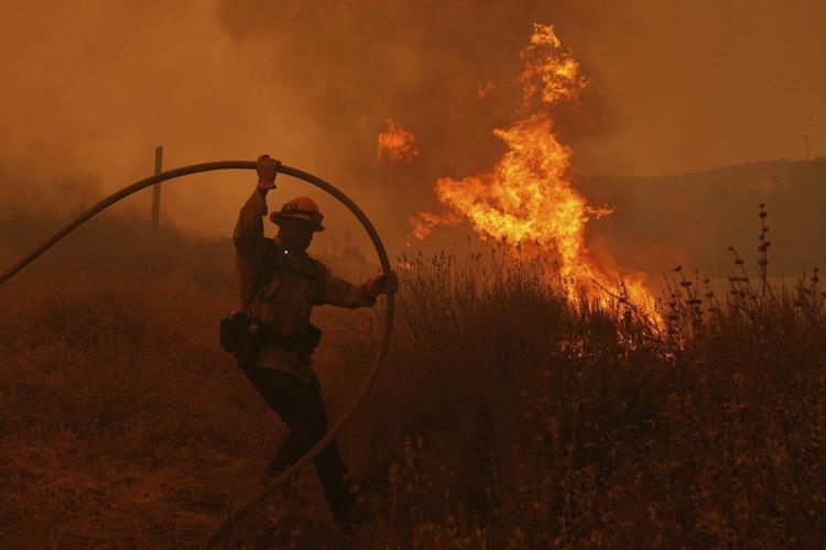 Firefighters make progress against blaze that forced thousands to flee north of Los Angeles