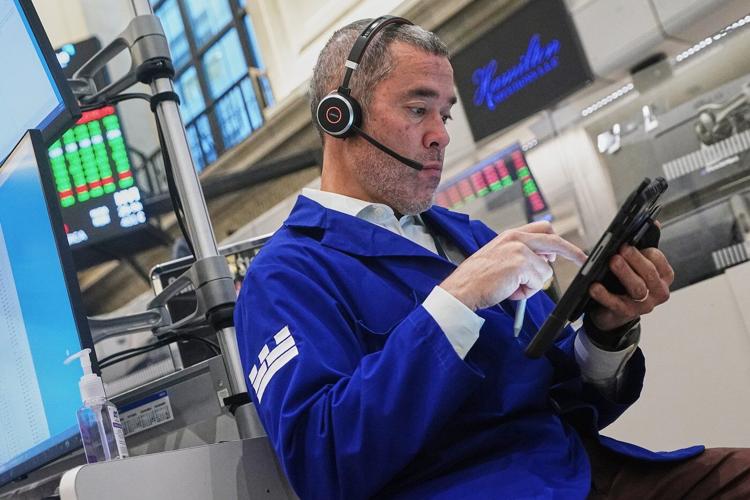 Wall Street swings through another unsettled day ahead of a crucial couple of tests