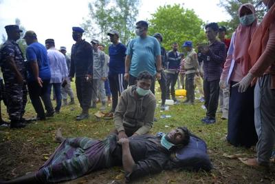 58 weak Rohingya land on Indonesian beach after weeks at sea