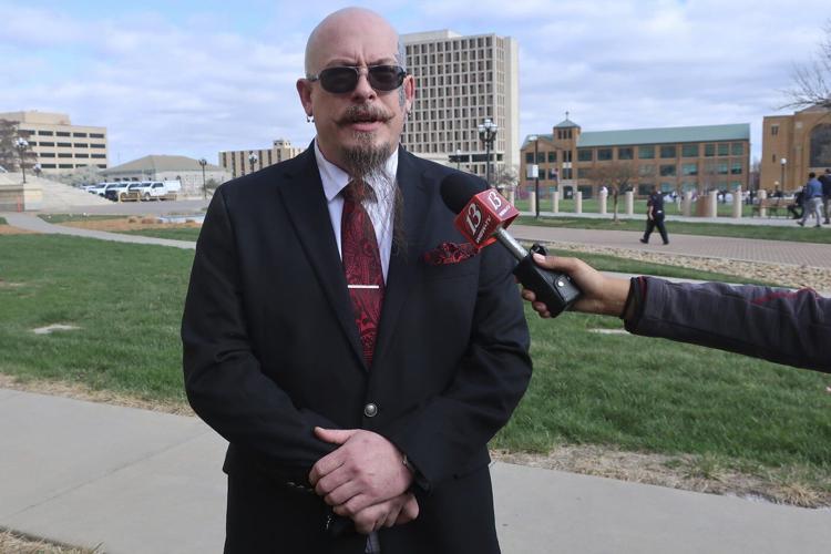 Satanist leader's attempt to hold Black Mass in Kansas Statehouse sparks chaos and 4 arrests