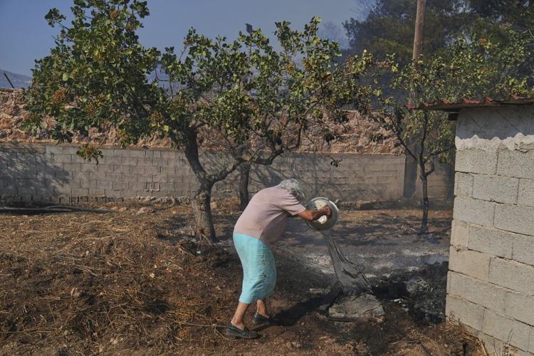 Photos of burning wildfires in Greece
