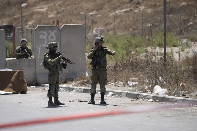 Palestinians clash with their own security forces in a West Bank refugee camp, leaving 1 dead