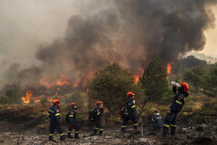 Greek firefighters make progress in taming deadly forest blaze burning for 4 days