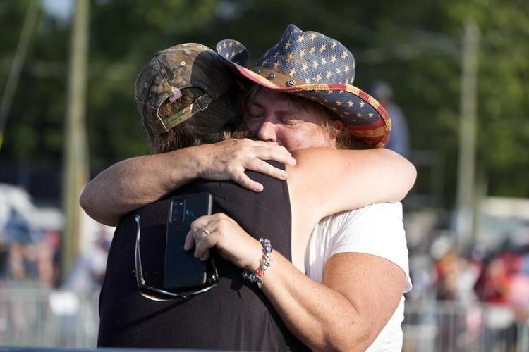 The Latest: Trump calls for unity after apparent assassination attempt