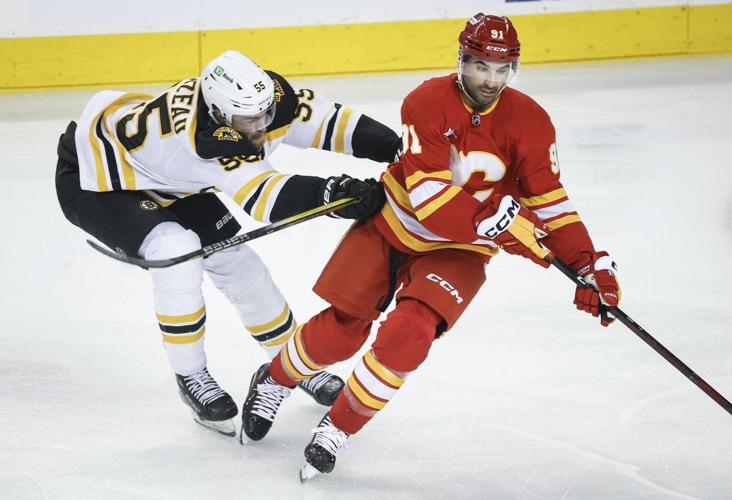 Pastrnak scores in OT as Bruins rally to beat Flames 4-3