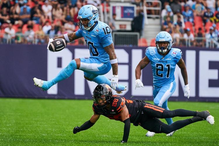 Nick Arbuckle throws three TD passes, scores another to lead Argos pas Lions