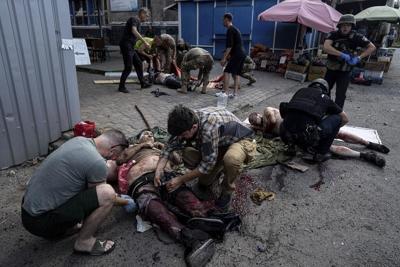 Russian missile turns Ukrainian market into fiery, blackened ruin strewn with bodies