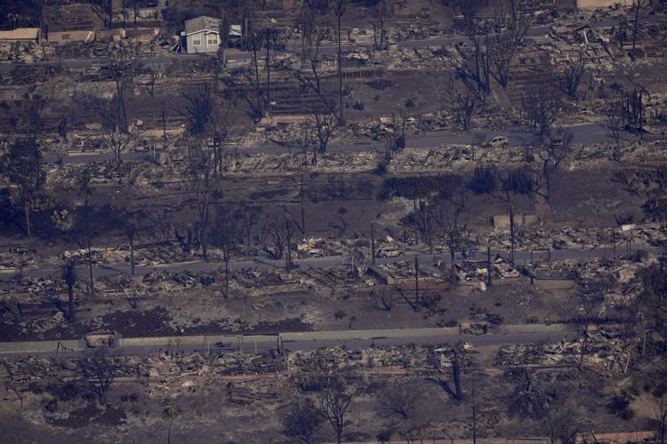 Firefighters make progress slowing wildfires while Los Angeles grapples with scope of devastation