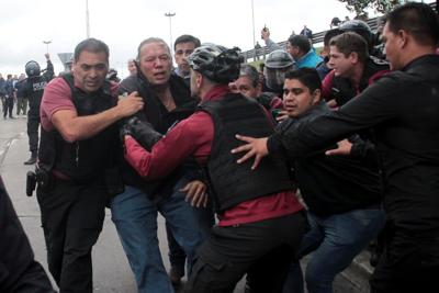 Security official in Argentina punched, kicked at protest
