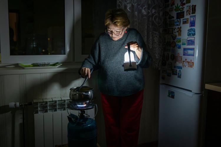 Freezing and in the dark, Kyiv residents are stranded in tower blocks as Russia targets power system